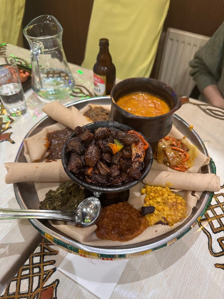 Discover the flavors of Ethiopia in London with our guide to the top Ethiopian restaurants in the city. From traditional stews to vegan options, we've got you covered for a delicious dining experience. #londonfoodguide #londonrestaurants | Places To Eat In London | Ethiopian Restaurants In London | African Restauarants In London | London Food Scene | Unique Places To Eat In London | Quirky Places To Eat In London #london #brixton #camberwell #camden #kentishtown #finsburypark #northlondon