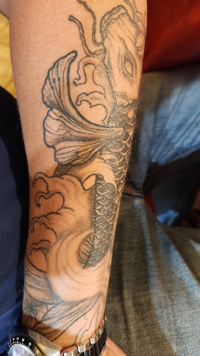 Le Trait Noir Tatouage - Piercing - Créations artistiques - Thumbnail