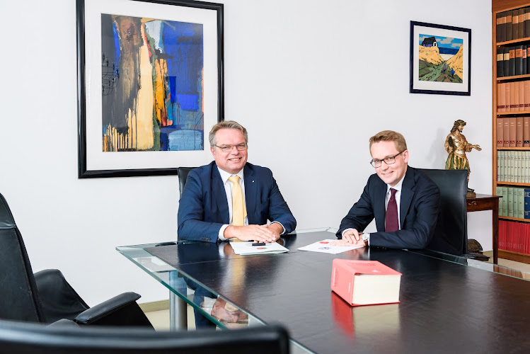 Notary Prof. Dr. Baumann and notary Dr. Fabi