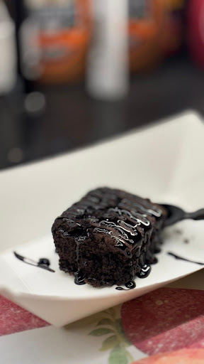 Rich, fudgy and completely eggless, topped with a generous drizzle of smooth chocolate syrup. 🍫✨… post image