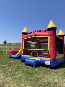 Colorful inflatable bounce house set up outdoors on a sunny day