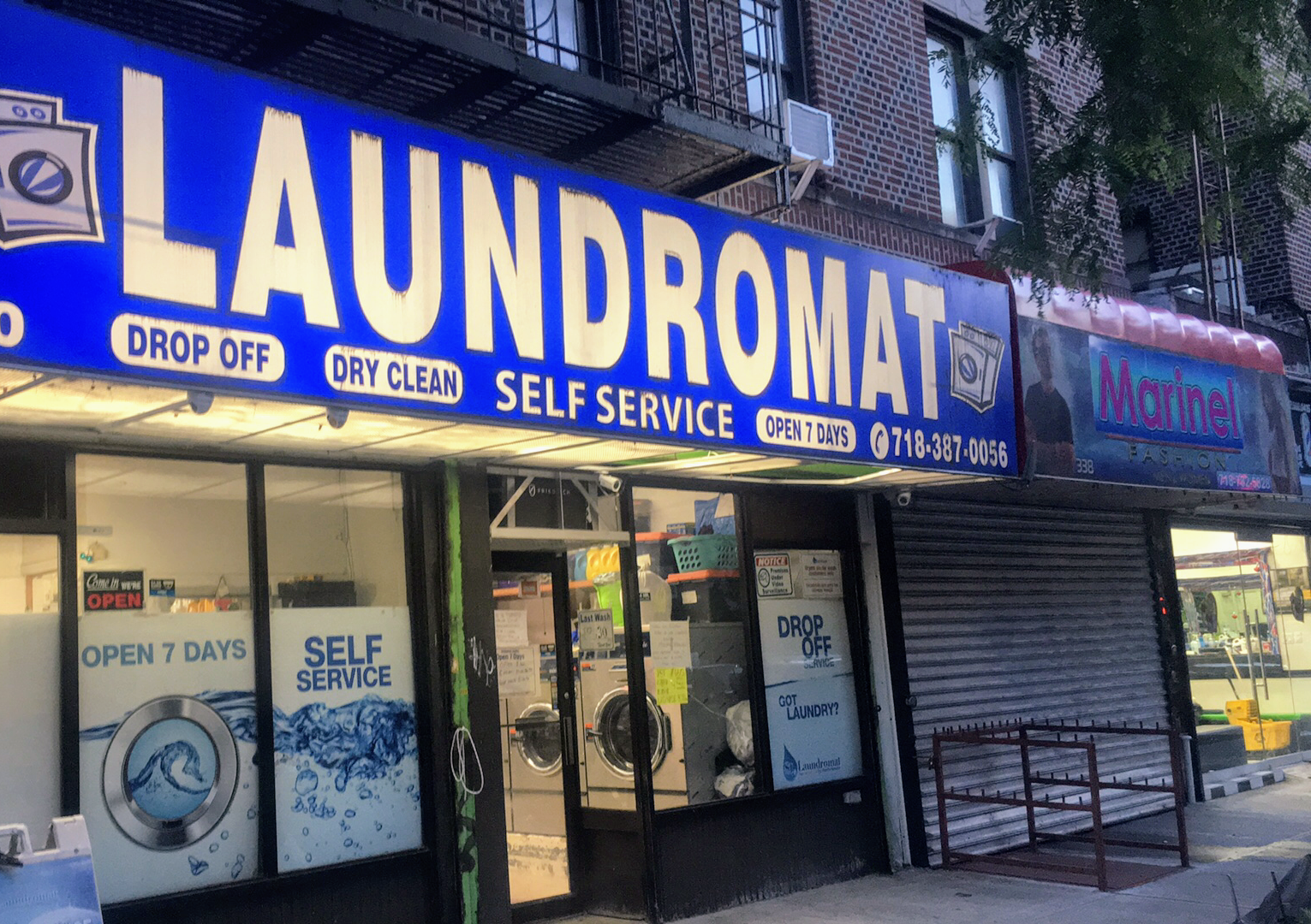 Si Laundromat storefront and entrance in Brooklyn
