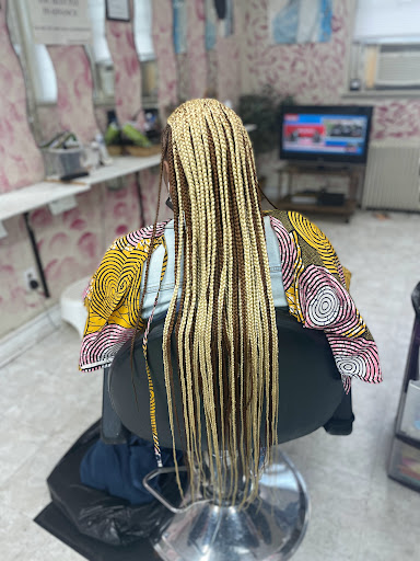 zaki hair braiding Logo