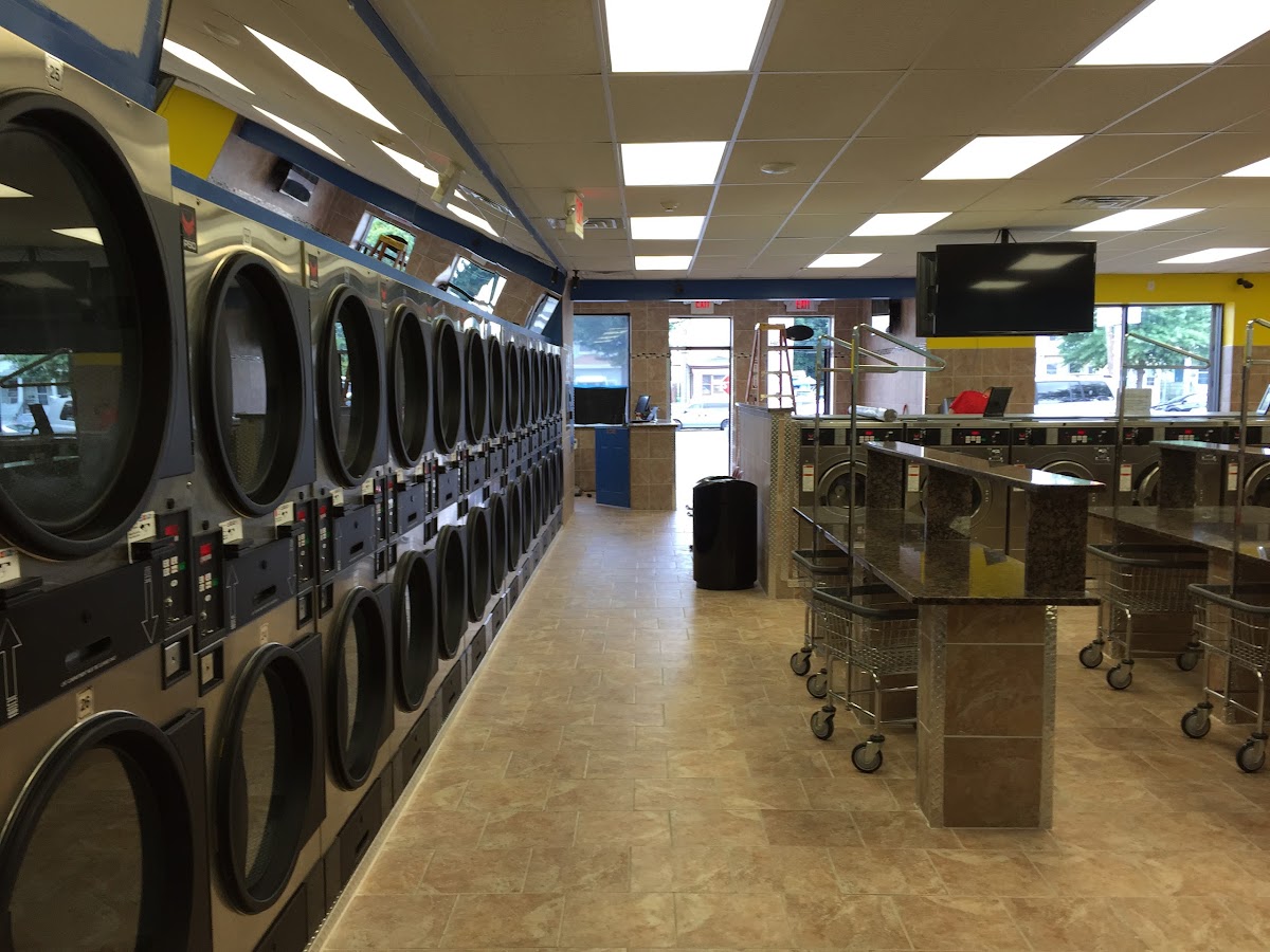 Clean laundry equipment at Madison Laundromat in Paterson, NJ