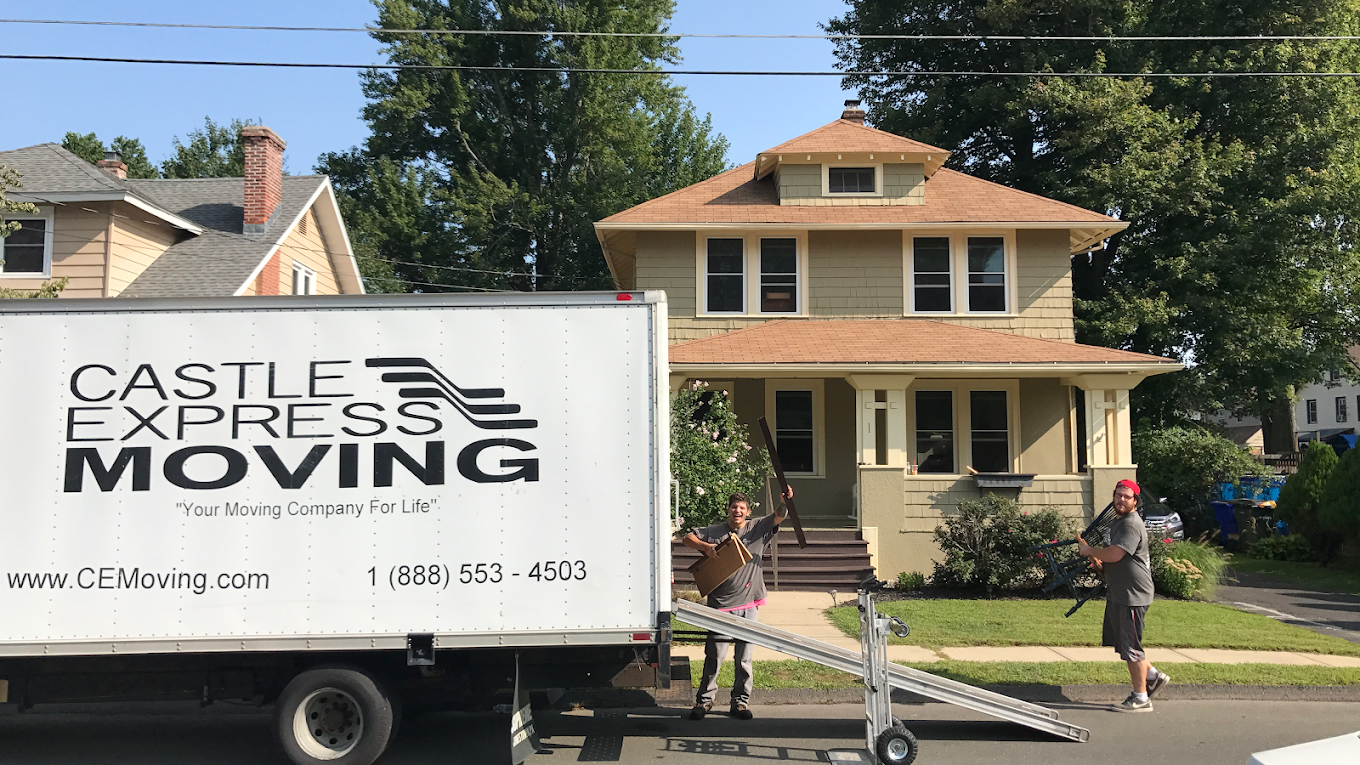 a castle express moving truck outside the neighborhood