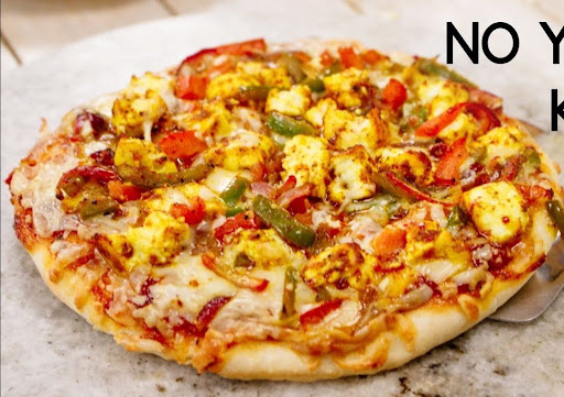 Indulge in Our Kadhai Paneer Pizza Delight! post image