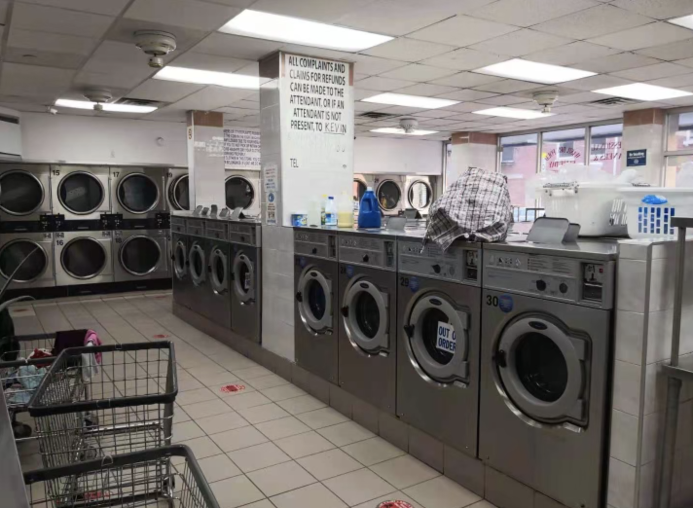 Clean laundry equipment at Madison Supreme Laundromat in New York, NY