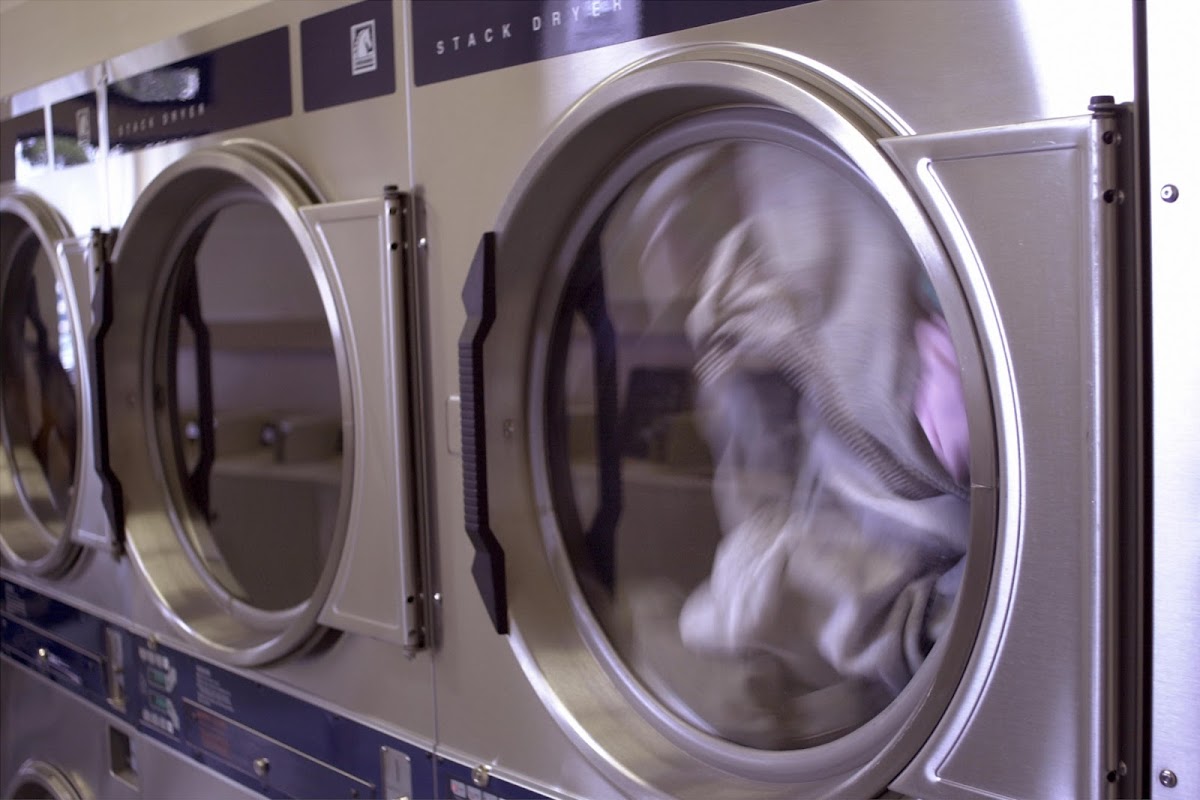 Clean laundry equipment at Cedar Street Laundromat in New Haven, CT