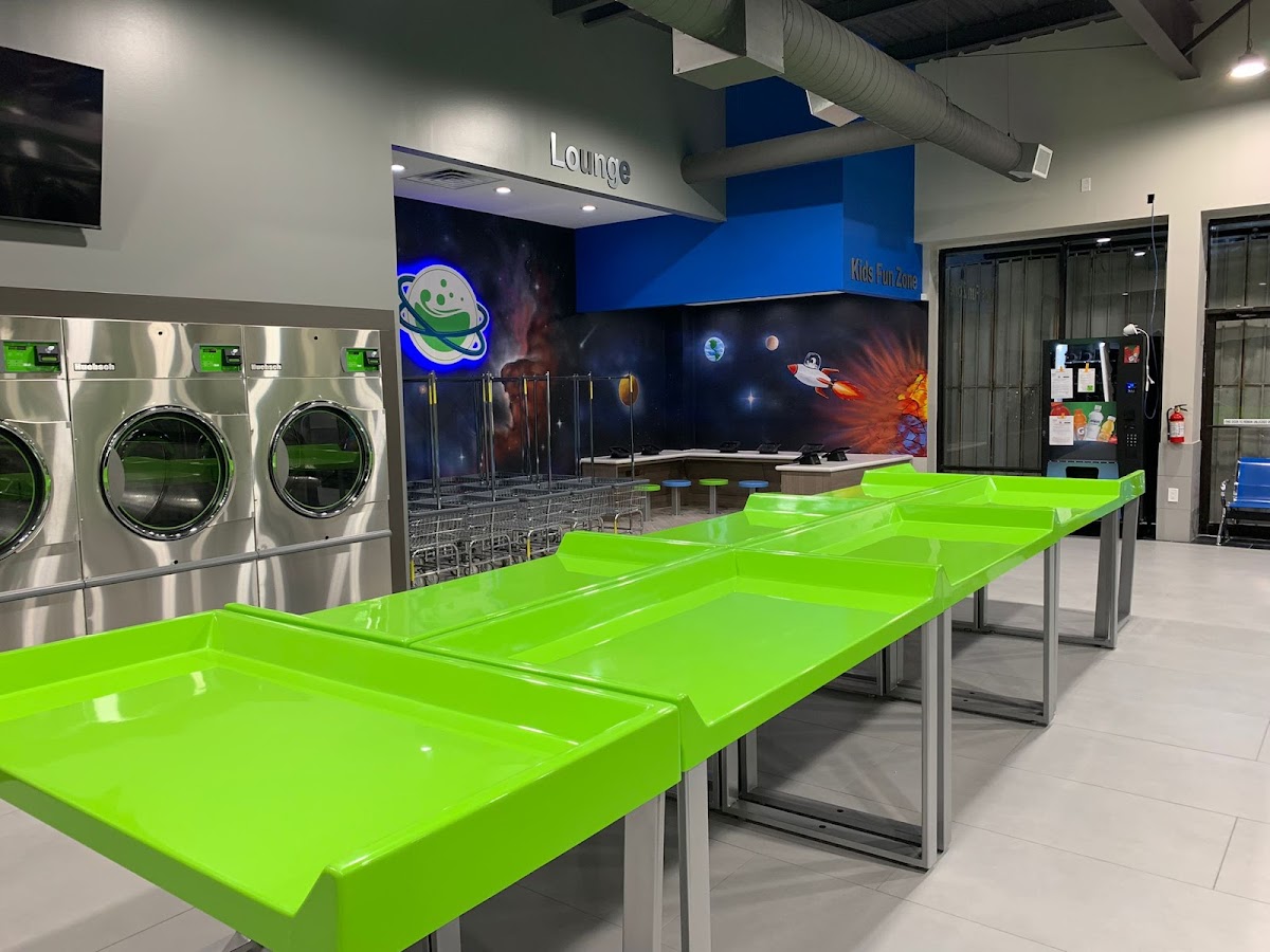 Space City Laundry/Lavanderia West Airport laundromat interior in Houston, TX