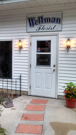 Wellman Florist and Greenhouse Logo