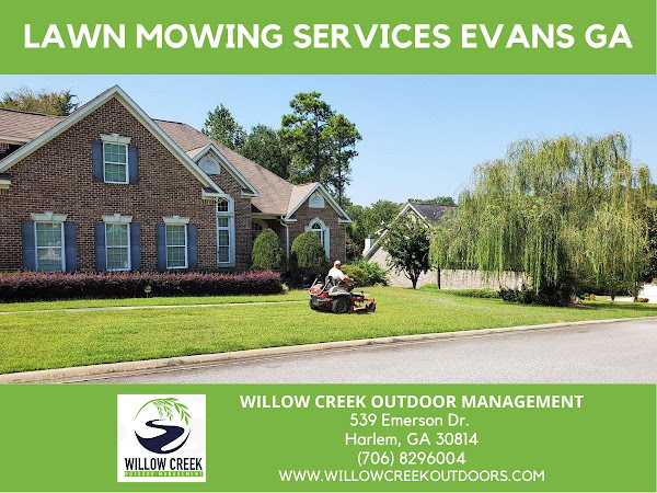 Evans GA lawn mowing services man on riding lawn mower in front yard