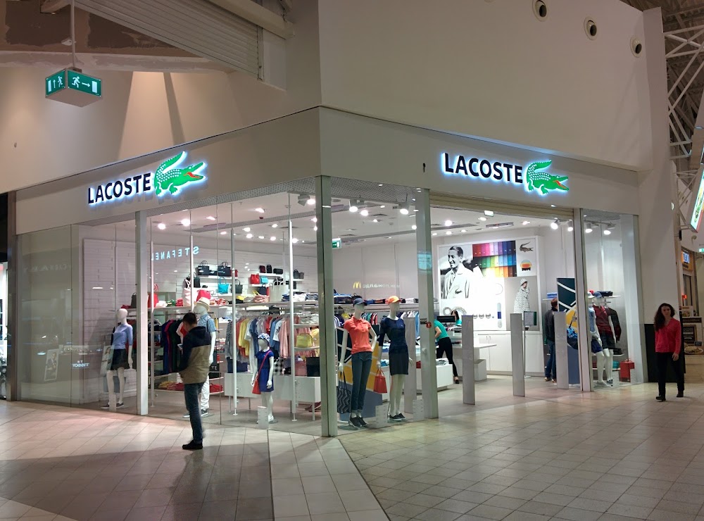 Победа казань часы. Лакост Казань. Lacoste магазин. Lacoste Казань мега. Лакоста Казань Молл.