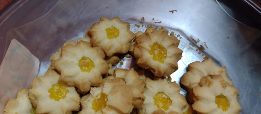Pastelería y galletas la chocolatta Logo