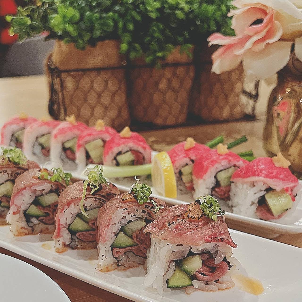 My lunch today! Treated myself to a Lover's roll (tuna, salmon, avocado on  a shrimp tempura and krab roll with eel sauce) and a Crunchy Dragon roll  (tuna and masago over a