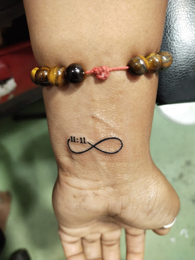 Infinity with 11:11 tattoo post image