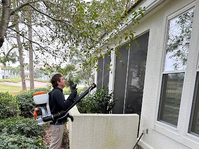 pest control technician applying mosquito control