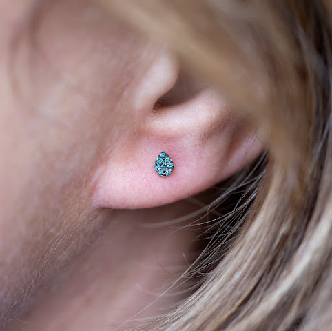 IRIS - a piercing studio by null