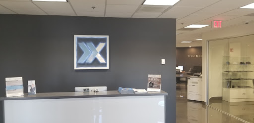 Xcellence Realty Corporate Office Logo