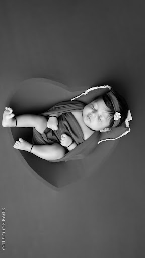 Wrapped in love and resting in a heart. 🤎 A timeless newborn photoshoot featuring rich earthy col… post image