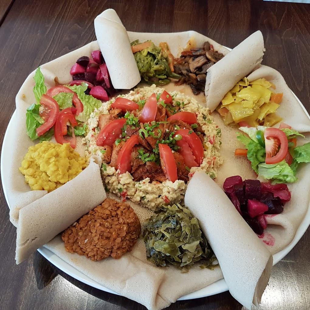 Discover the flavors of Ethiopia in London with our guide to the top Ethiopian restaurants in the city. From traditional stews to vegan options, we've got you covered for a delicious dining experience. #londonfoodguide #londonrestaurants | Places To Eat In London | Ethiopian Restaurants In London | African Restauarants In London | London Food Scene | Unique Places To Eat In London | Quirky Places To Eat In London #london #brixton #camberwell #camden #kentishtown #finsburypark #northlondon