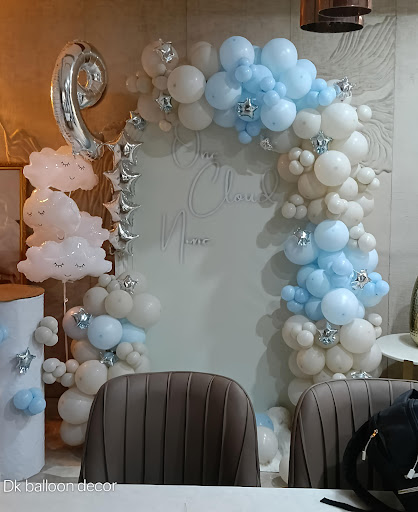 This is a beautiful baby shower or first birthday decoration. It features an arch made of white a… post image