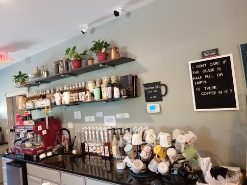 Busy Bean Cafe + Sprouts Bakery and Delicatessen Logo