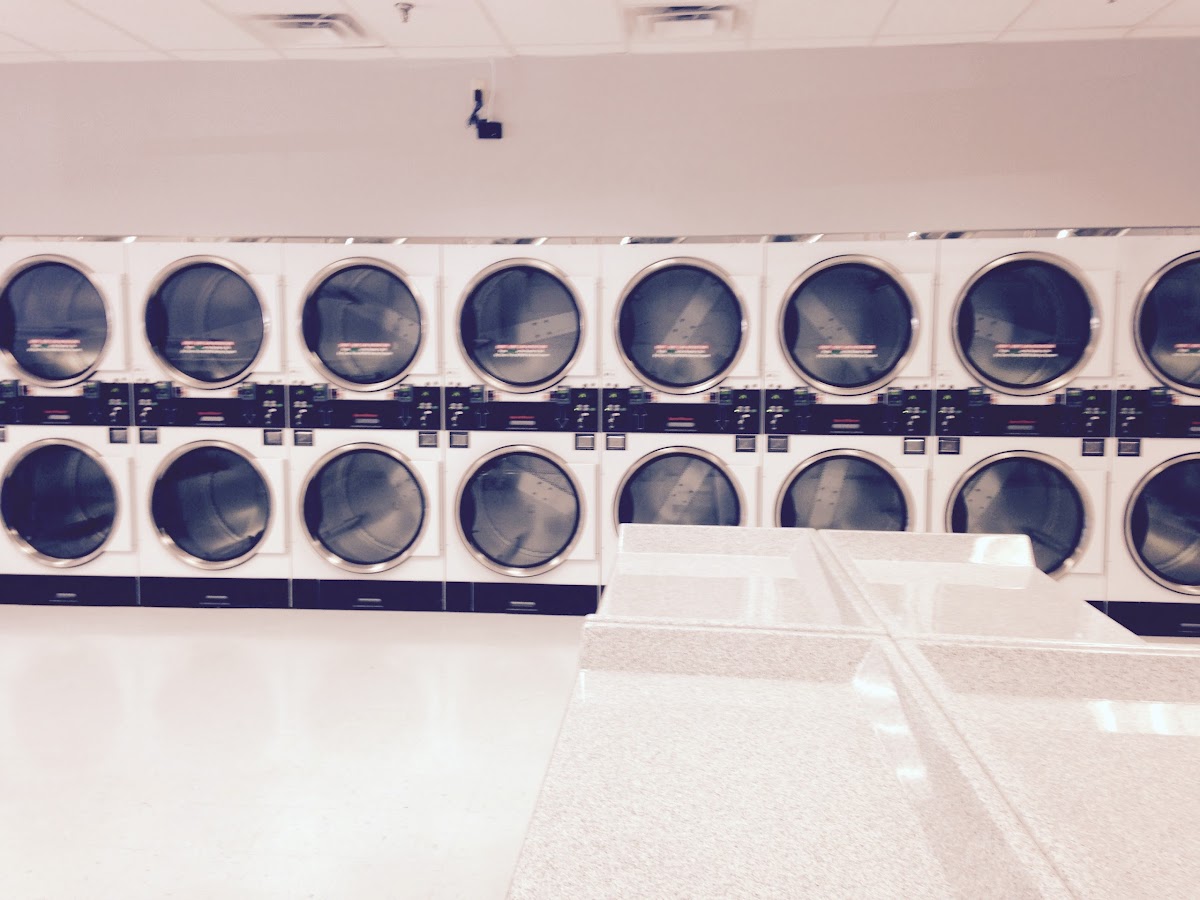 Merrimack Commons Laundromat facility with washing machines in Manchester