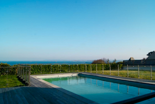 Photo de Résidence Kersaliou Ty Prat piscine vue mer