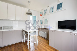 Photo n°1 de Agence immobilière Guy Hoquet PARIS 18 JULES JOFFRIN à Paris (Agence de location immobilière)