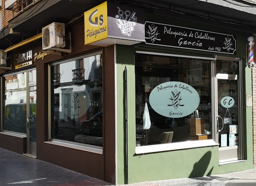 García Peluquería de Caballeros Logo