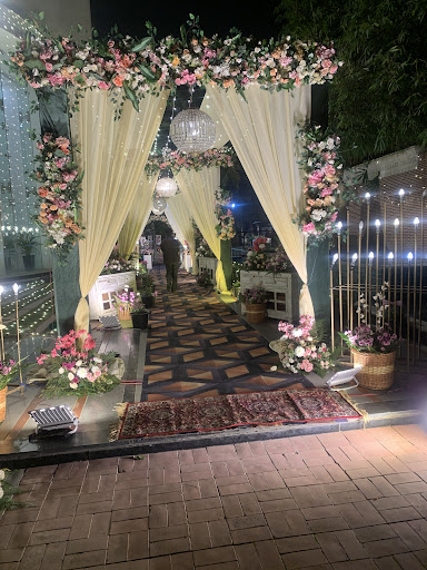 Elegant tent setups feature luxurious fabric drapes, vibrant lighting, and floral accents for wed… post image