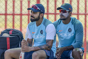 Captain Virat Kohli and Umesh Yadav of India during the Indian national men's cricket team training session and press conference at SuperSport Park on January 12, 2018 in Pretoria, South Africa. 