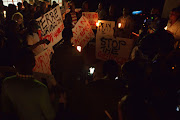 Kenyans and Burundians living in Kenya hold a vigil in Nairobi to call for an end to killings in Burundi. AFP Photo