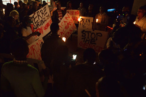 Kenyans and Burundians living in Kenya hold a vigil in Nairobi to call for an end to killings in Burundi. AFP Photo