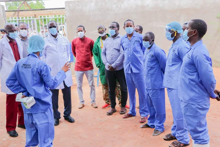 Wajir Governor Mohamed Abdi (in white apron) with health workers at the isolation centre at the county referral hospital on April 12, 2020.