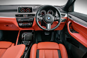 Lava interior scheme perfectly encapsulates the M35i’s fiery character.