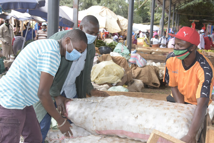 Traders at the Ruiru open-air market on Tuesday.