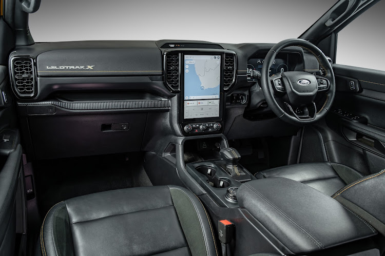 The interior is typically Wildtrak in layout and materials, including contrast stitching and a 10-inch digital display.