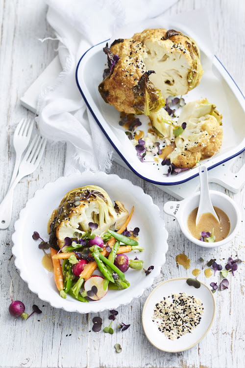 Whole roasted cauliflower with veg salad.