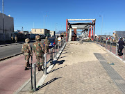 Soldiers near a vandalised bus station in Dunoon.
