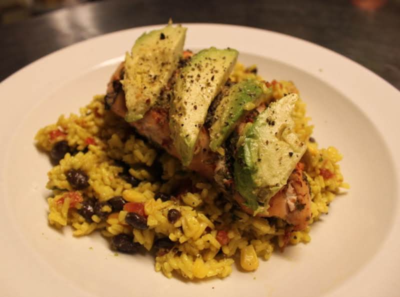 Southwest Yelllow Rice Salad Topped With Cliantro Lime Grilled Chicken Breast Garnished With Fresh Avacado Slices