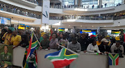 Fans await Banyana Banyana's arrival back from winning the 2022 Women's Africa Cup of Nations in Morocco.