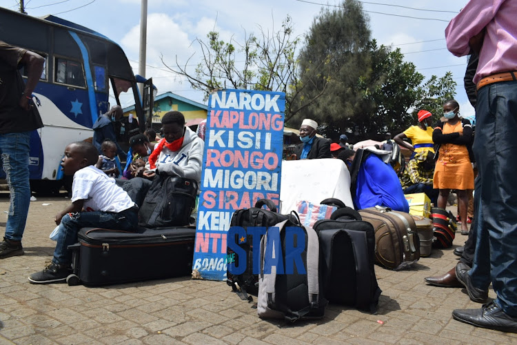 Passengers stranded at Nairobi CBD with the hopes of getting transport to Kisumu on March 28, 2021. / CHARLENE MALWA