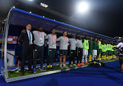 Stuart Baxter (head coach) of South Africa and staff during the African Cup of Nations match between South Africa and Namibia at Al-Salam Stadium on June 28, 2019 in Cairo, Egypt.