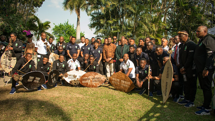 AmaZulu players and officials meeting new Zulu king at his palace.