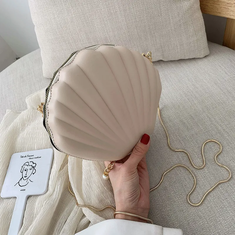 Bolso de hombro personalizado estilo occidental con cadena y diseño de concha, ideal para la moda diaria y un toque elegante.