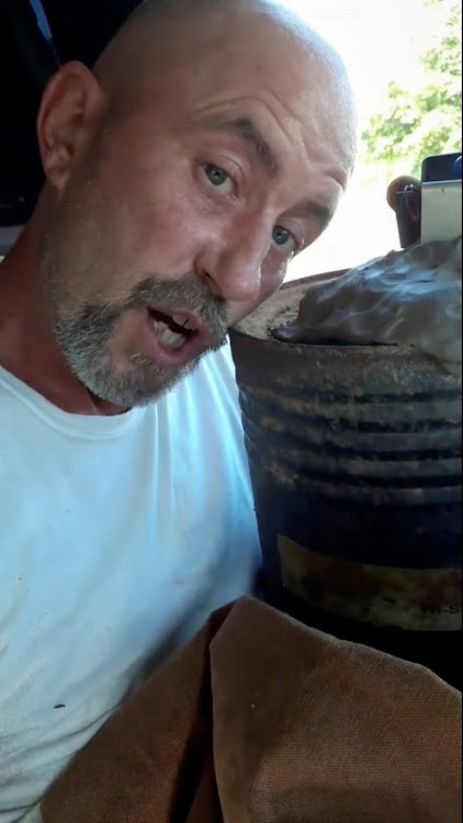 A man, identified by police as Floyd Ray Roseberry, who claims to be sitting in his truck with explosives, speaks during a Facebook livestream in a still image from video taken in Washington, U.S. on August 19, 2021.