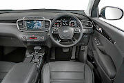 Highlights of the Kia Sorento interior: leather upholstery, an easy-to-use touchscreen infotainment system, dual-zone climate control and cruise control.