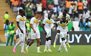 Senegal's Lamine Camara (on Sadio Mane's back) celebrates a goal during the 2023 Africa Cup of Nations match against Gambia at Charles Konan Stadium in Yamoussoukro on the January 15 2024.