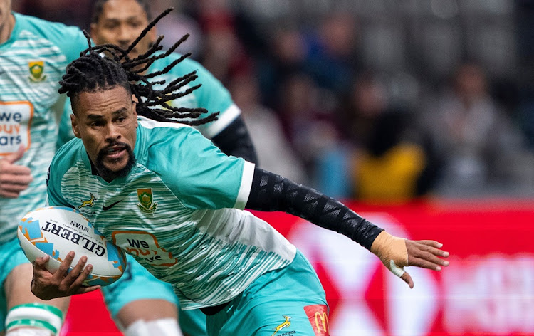 The Blitzboks' Selvyn Davids runs with the ball as in their Vancouver Sevens ninth-place playoff against Australia on Sunday night.